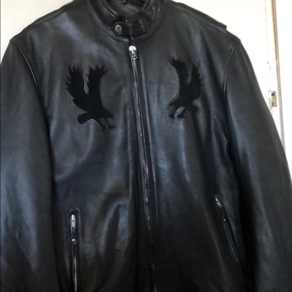 Black leather motorcycle rider jacket.